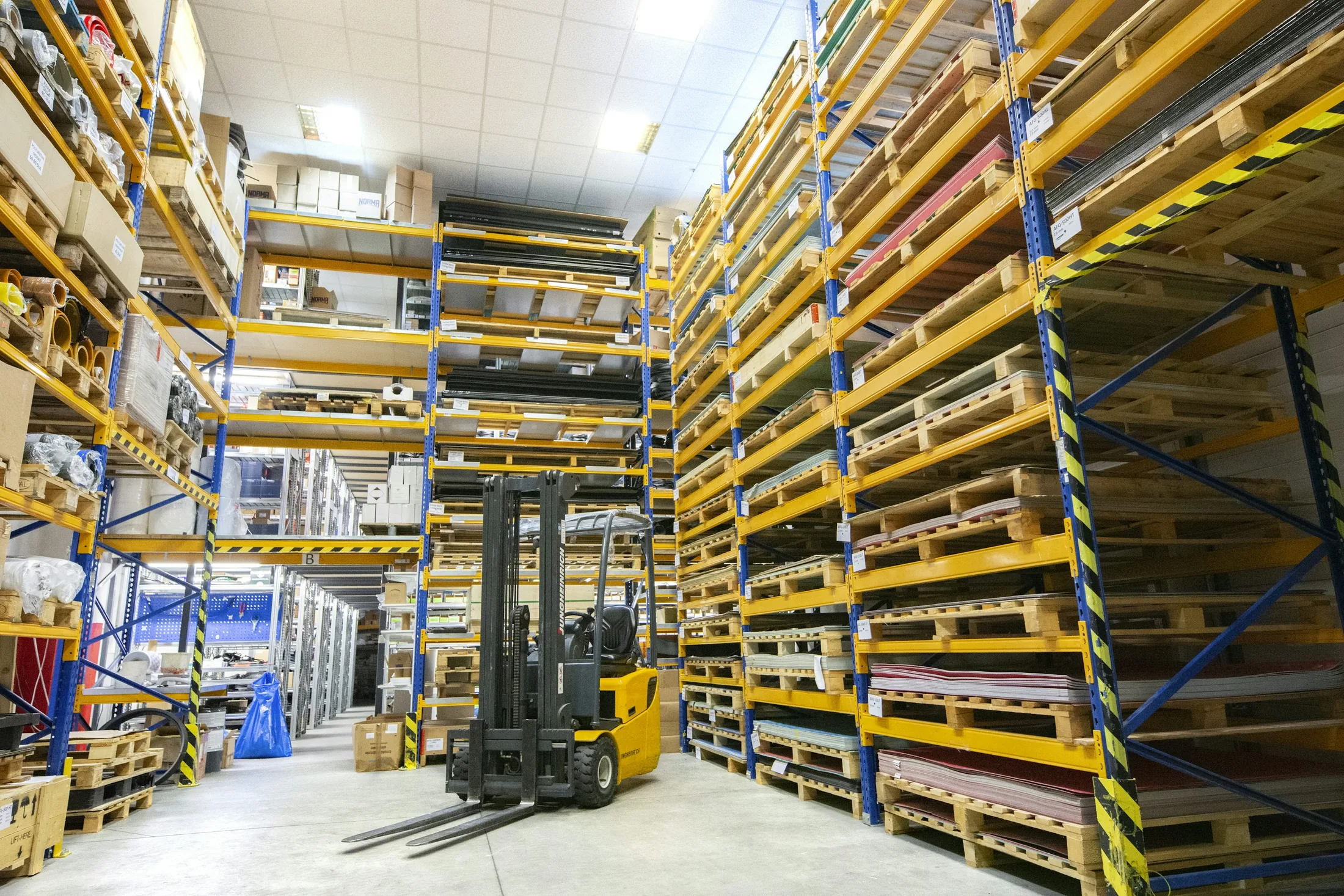 Warehouse aisle representing material supply coordination